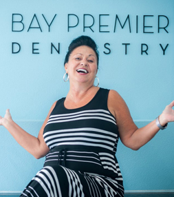 A smiling lady after a dental treatment at Bay Premier Dentistry